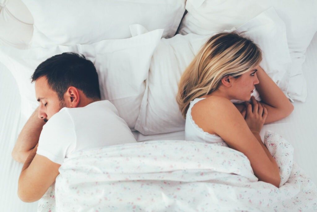 Unhappy-couple-in-bed