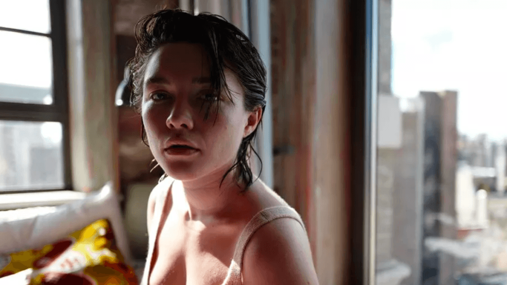 Florence Pugh with damp short brown hair.