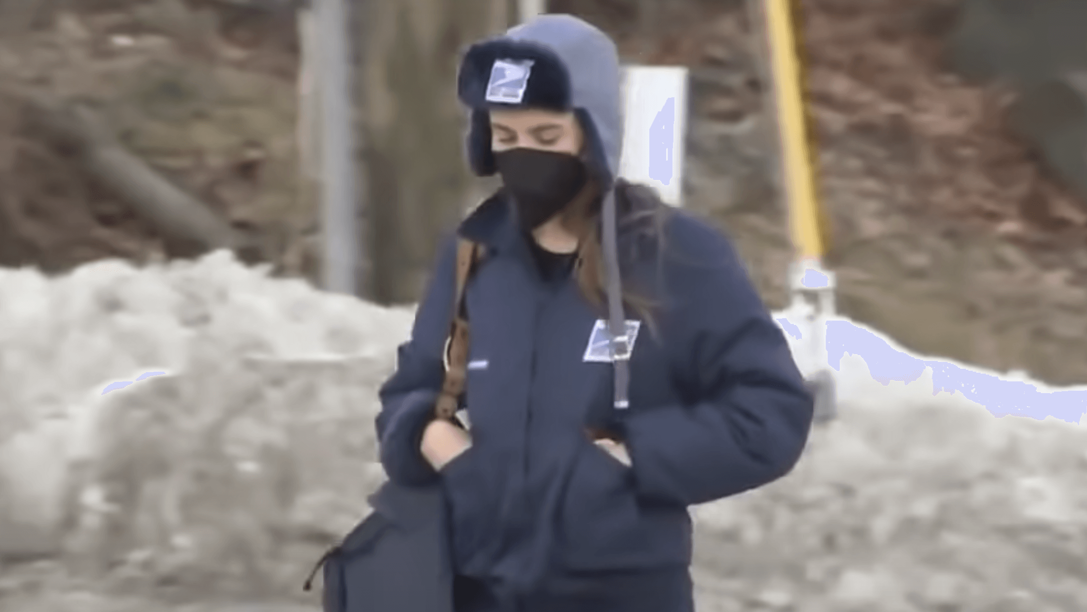 woman wearing a winter coat and a beanie