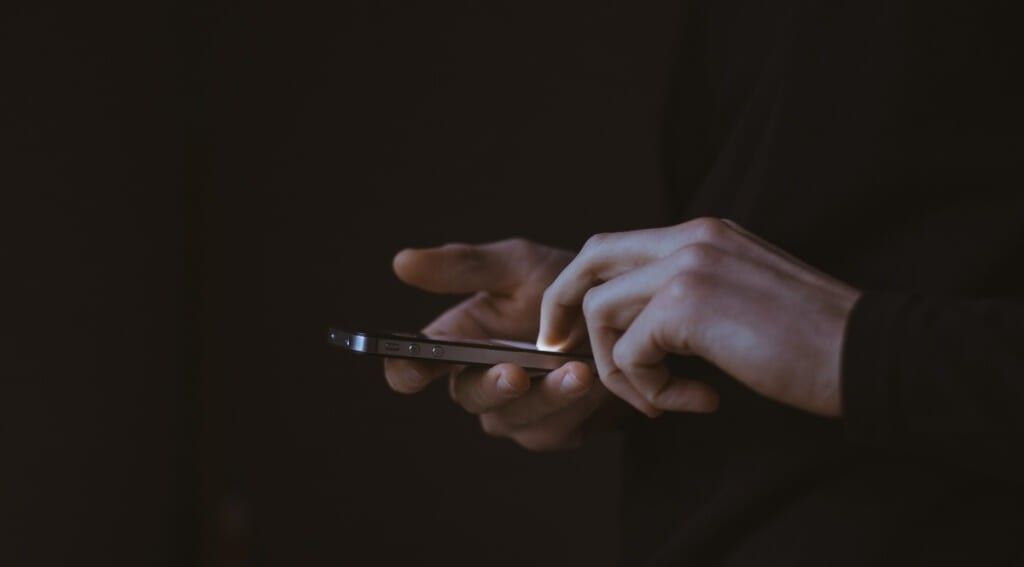 Close up of someone holding an iphone