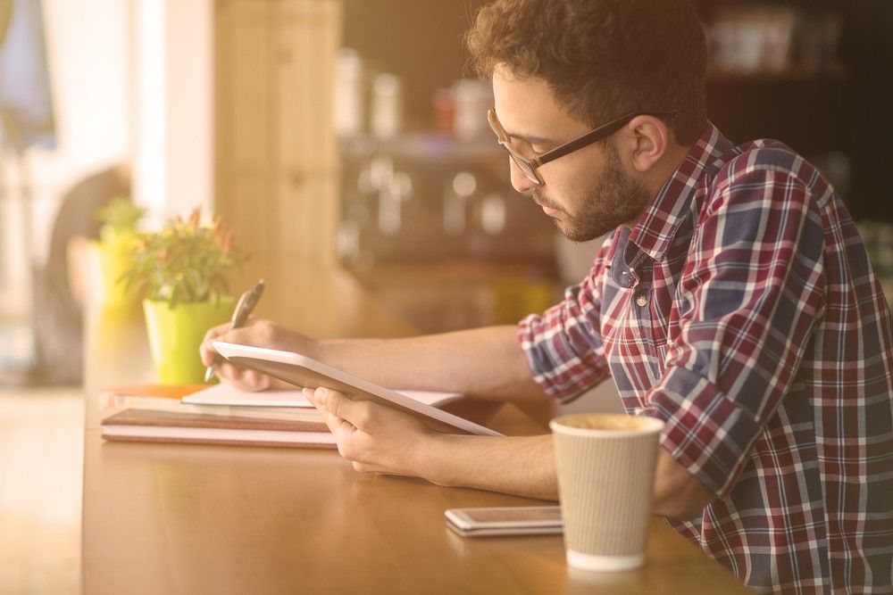 Student Writing an Essay with coffee