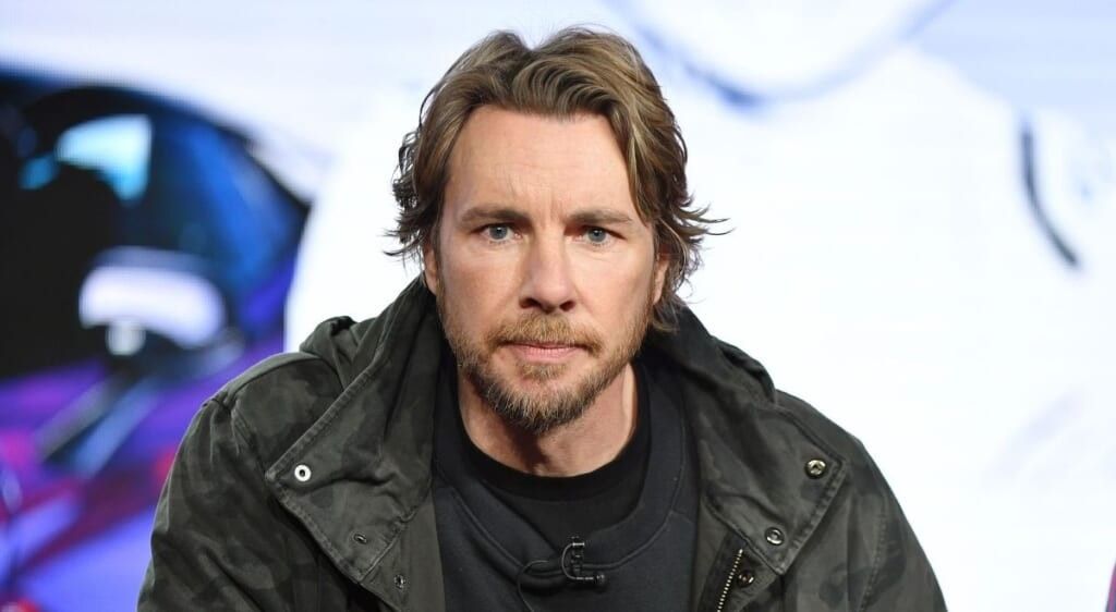 Dax Shepard in leather jacket looking at the camera.