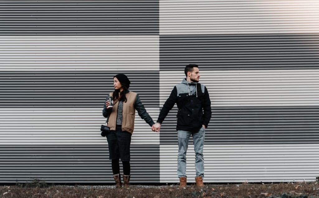 couple is unhappy looking in opposite ways