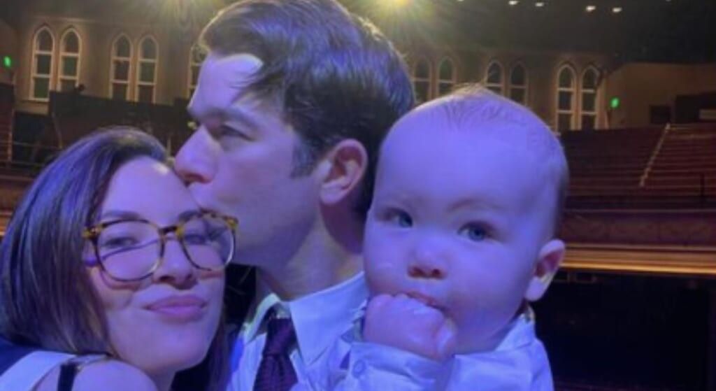 John Mulaney, Olivia Munn, and baby Malcolm taking a selfie.