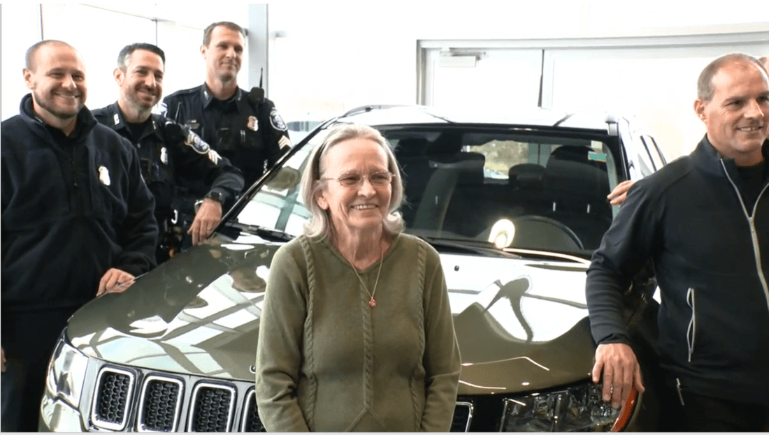 woman receives a new car