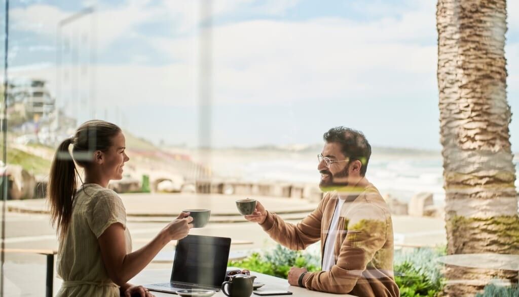 couple have coffee outside