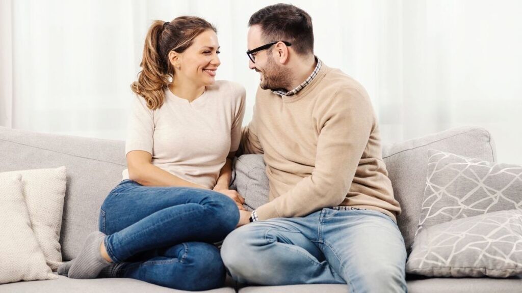 couple smiling on couch