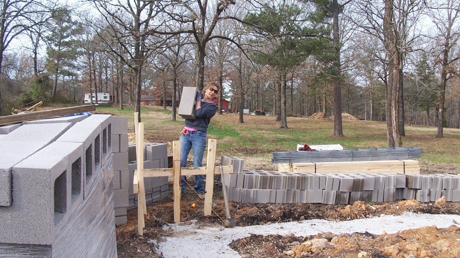 woman carrying a heavy block