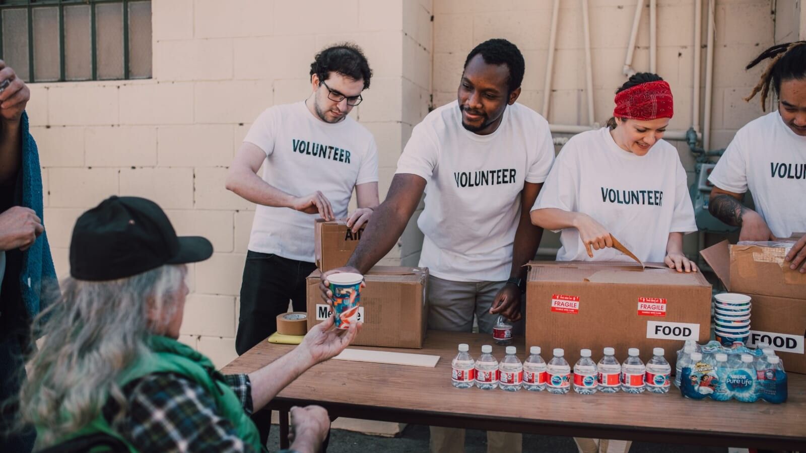volunteers giving out food