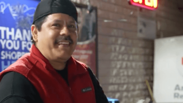 a man wearing a black and red outfit