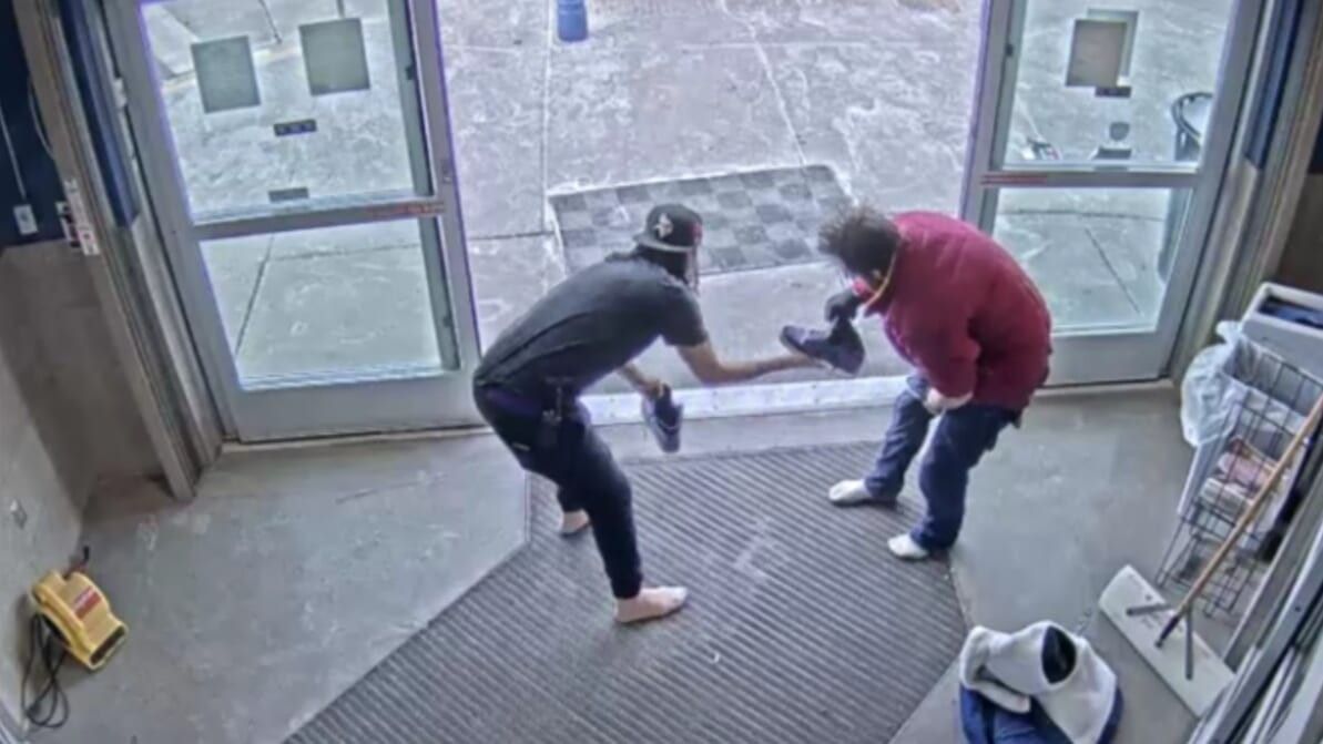 woman giving a man the shoes off of her feet