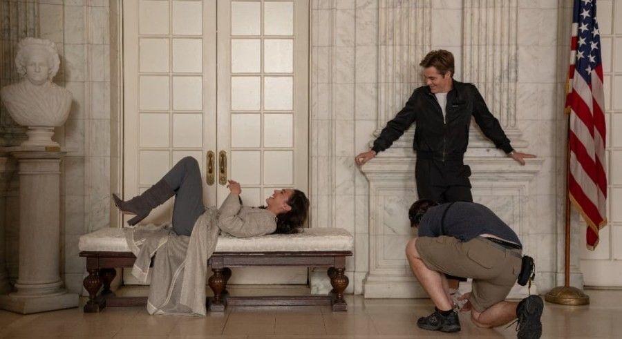 Gal Gadot and husband Jaron Versano laughing druing a photoshoot.