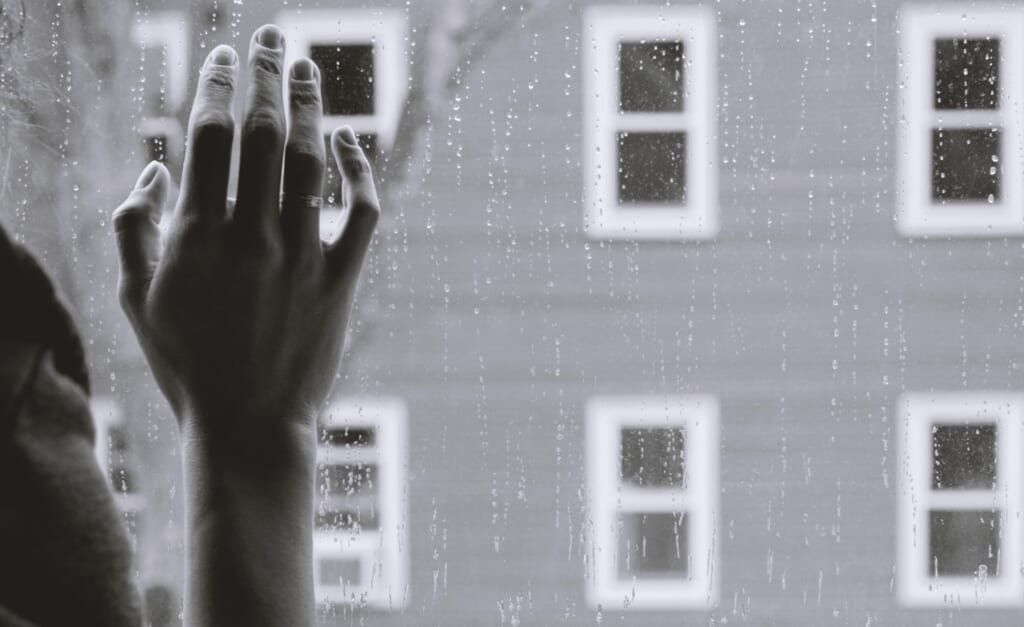 hand on glass window