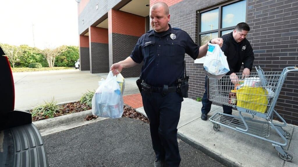 police hugging needy woman