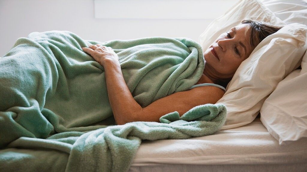 Woman lying in bed