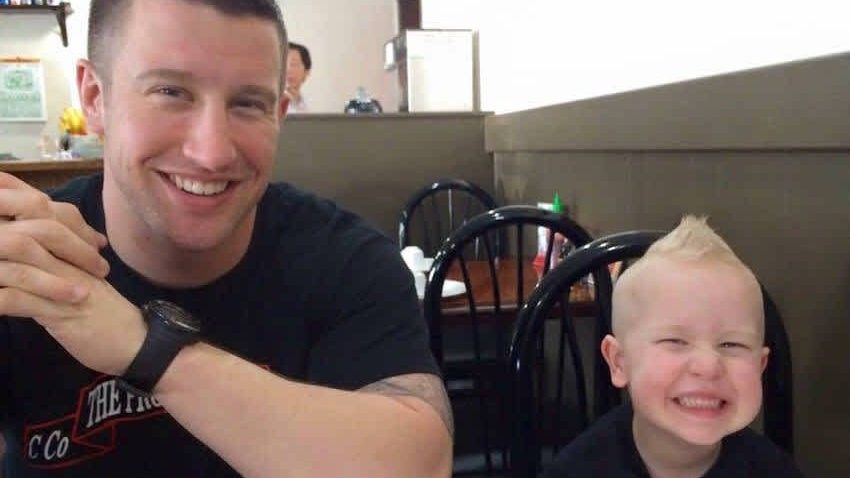 man with smiling little boy