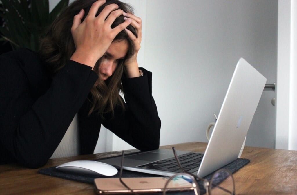 woman is stressed staring at computer