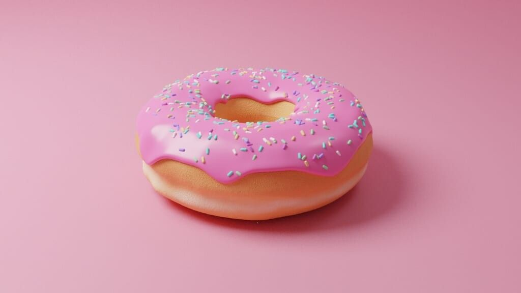 close up of donut pink frosting