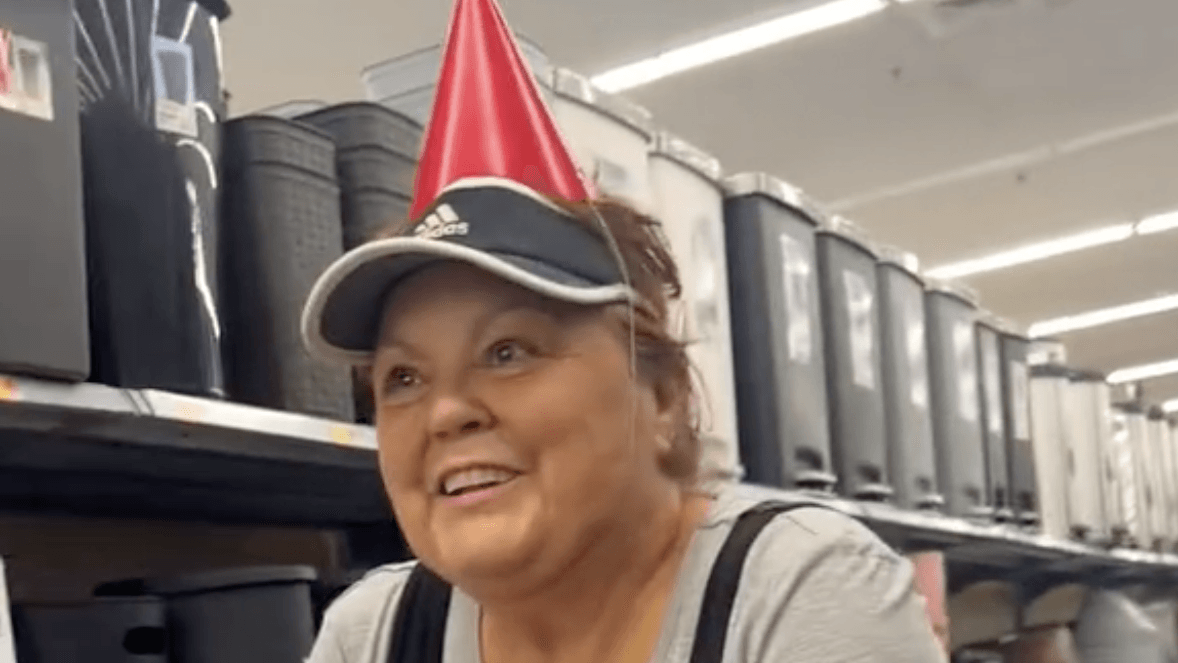 woman wearing a red party hat