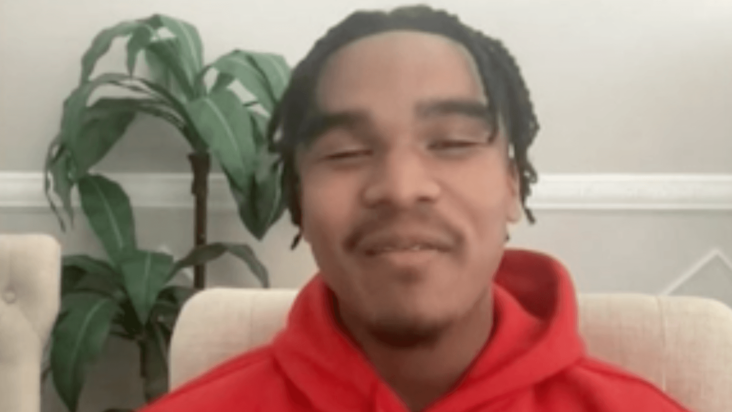 teen wearing a red hoodie