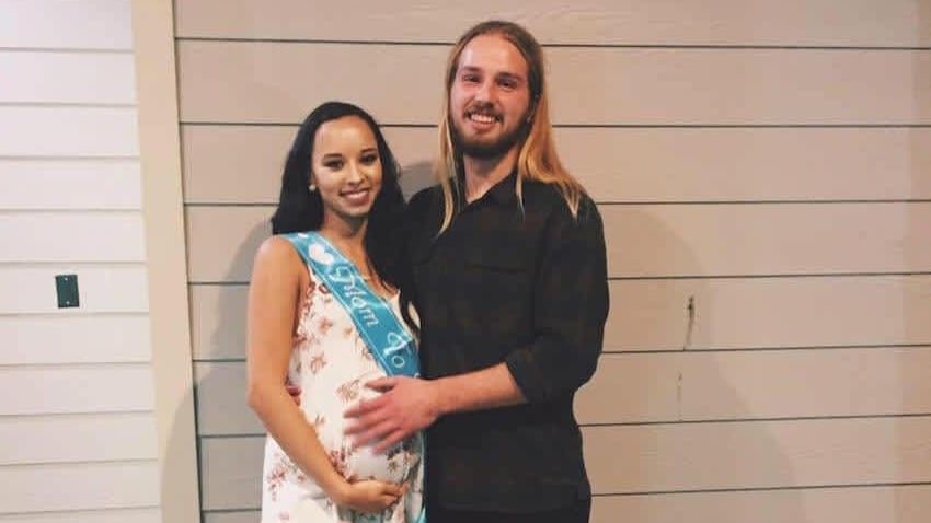 man standing with a pregnant woman