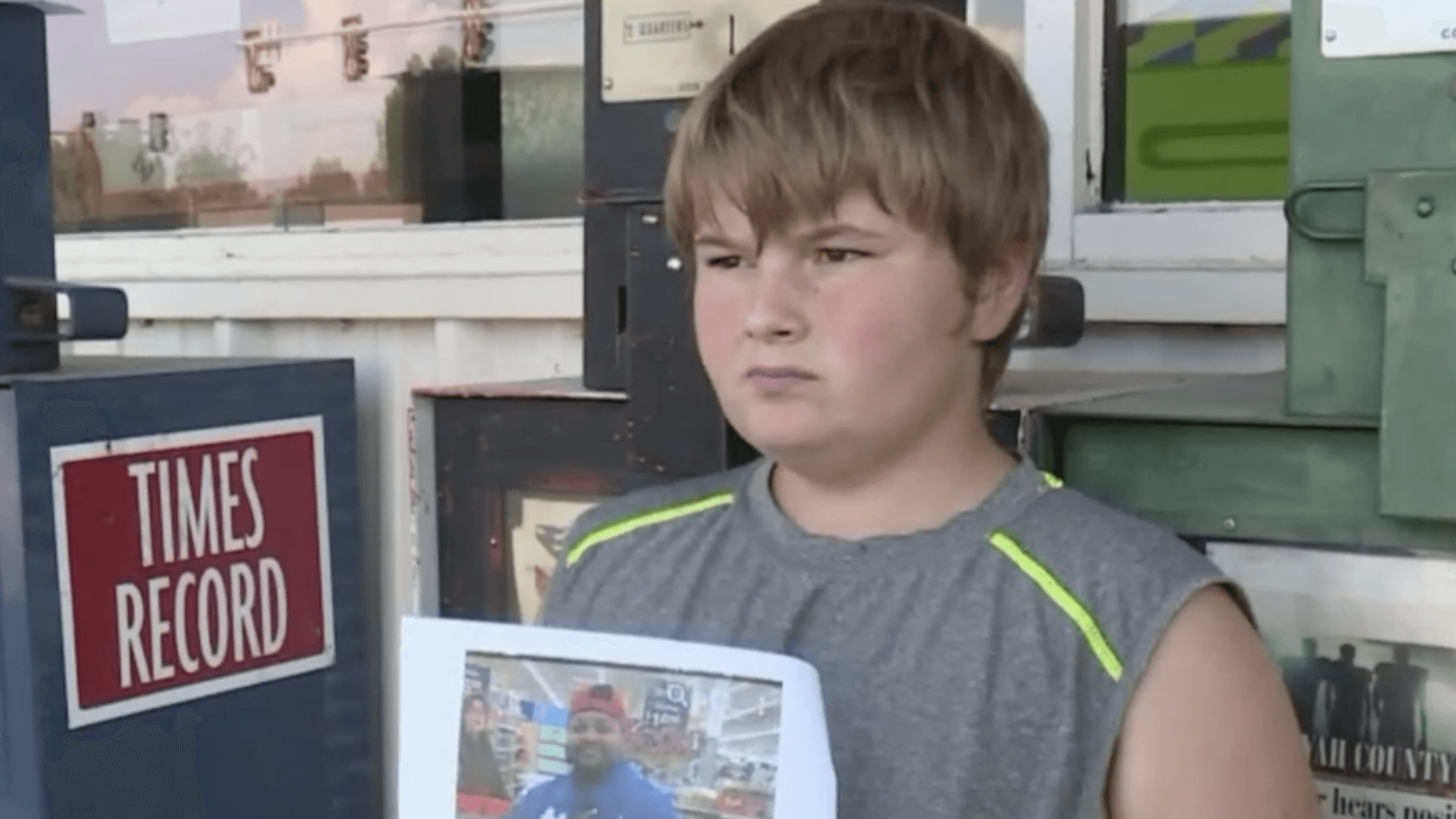 boy holding a photograph