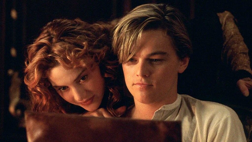 Kate Winslet looking over Leonardo DiCaprio