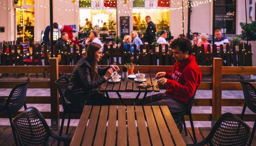 young man and woman on date outside