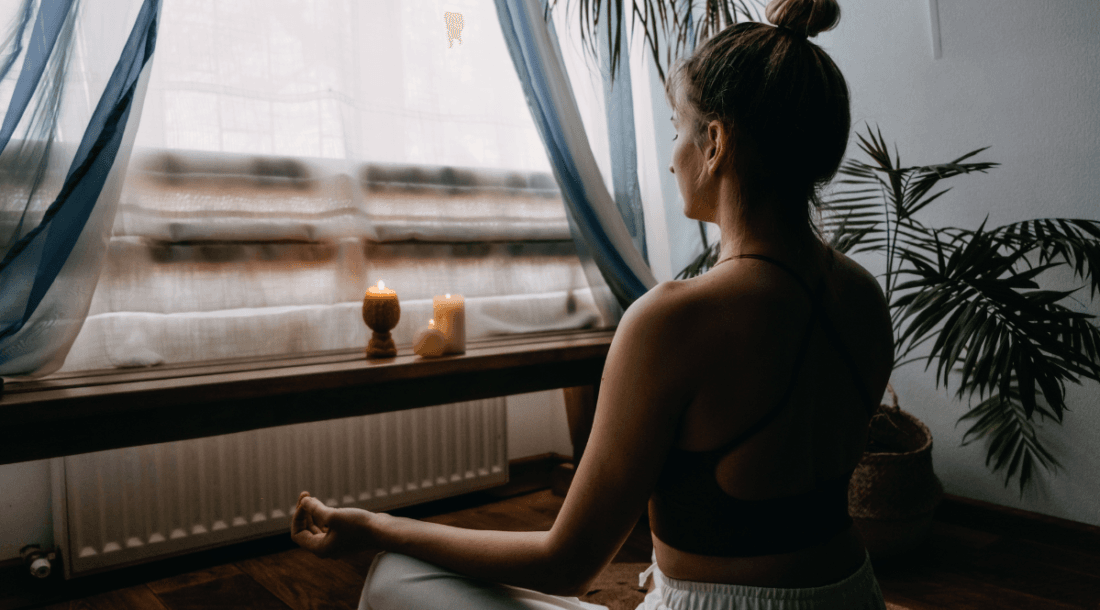 woman meditating at home