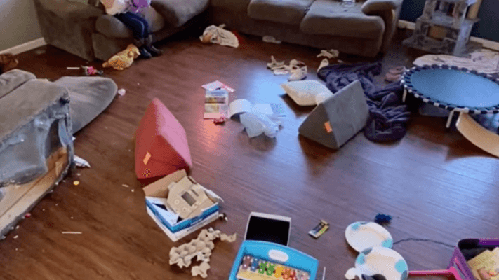 messy room with toys strewn on the floor