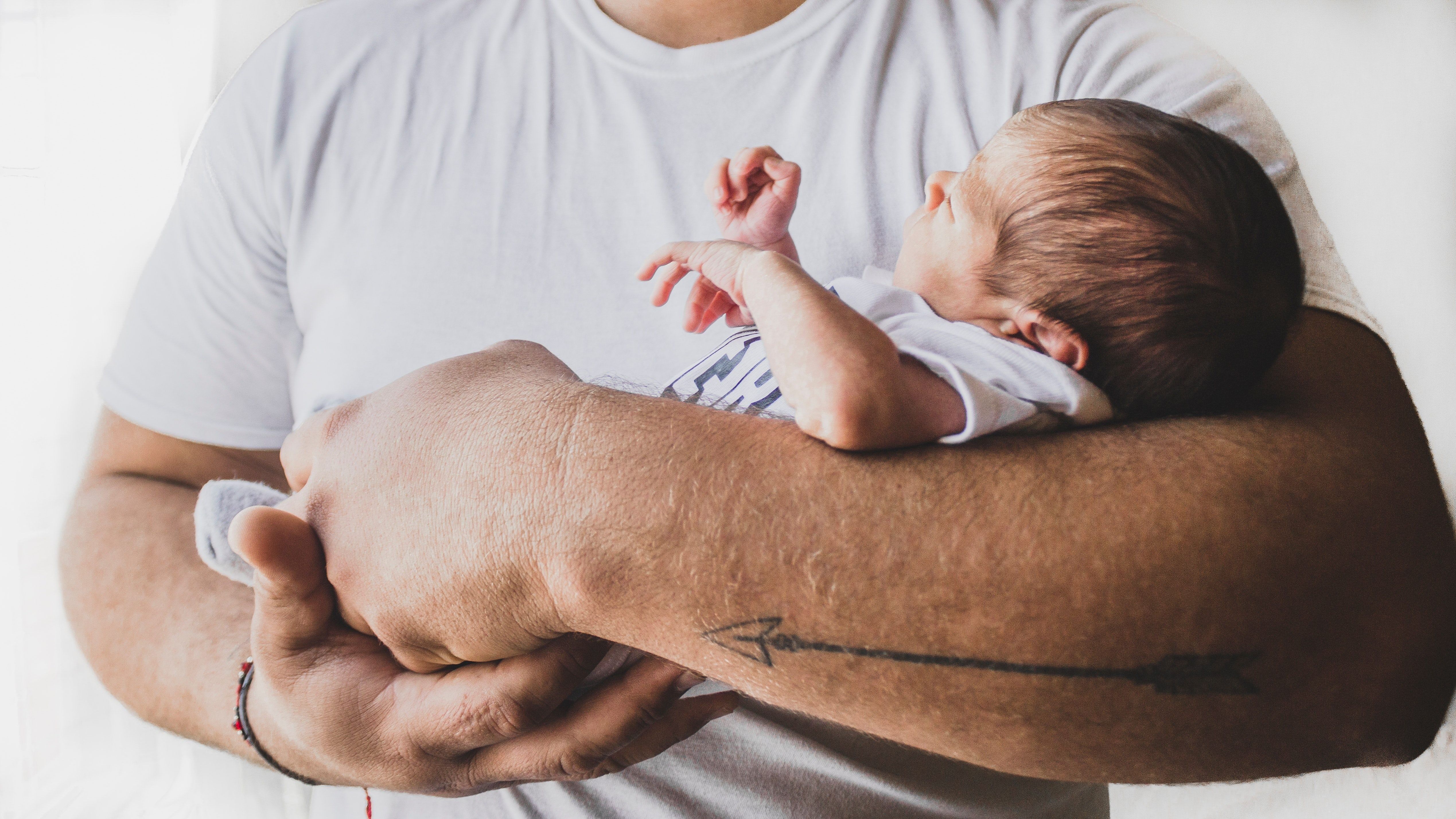 person holding a newborn baby