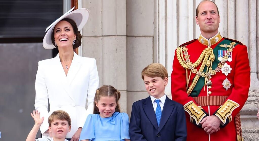 The Cambridges smiling with the children,