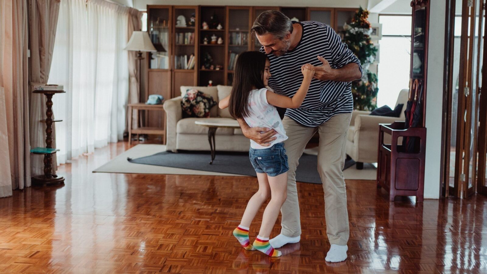 man dancing with his daughter