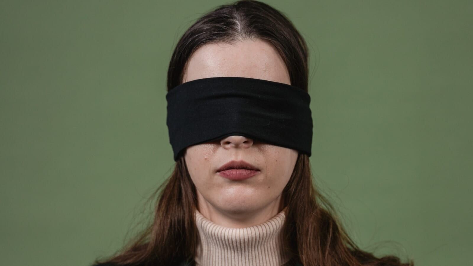 woman blindfolded with a black cloth