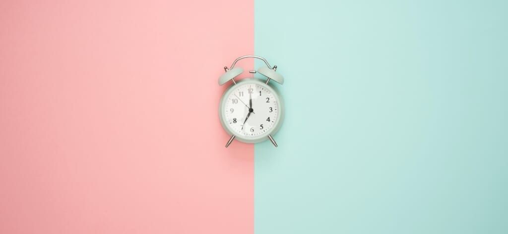clock on pastel background