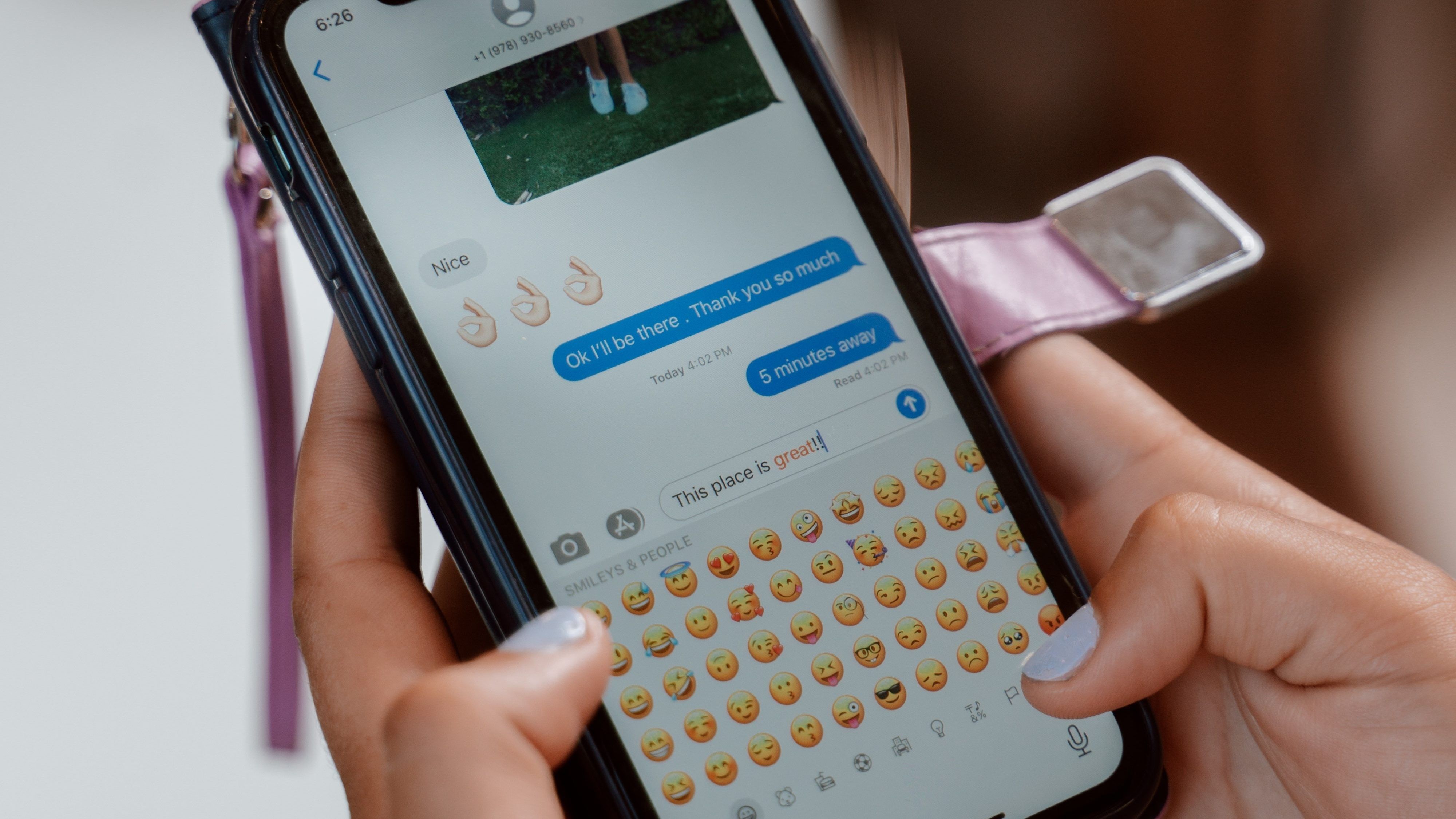 person messaging on their phone