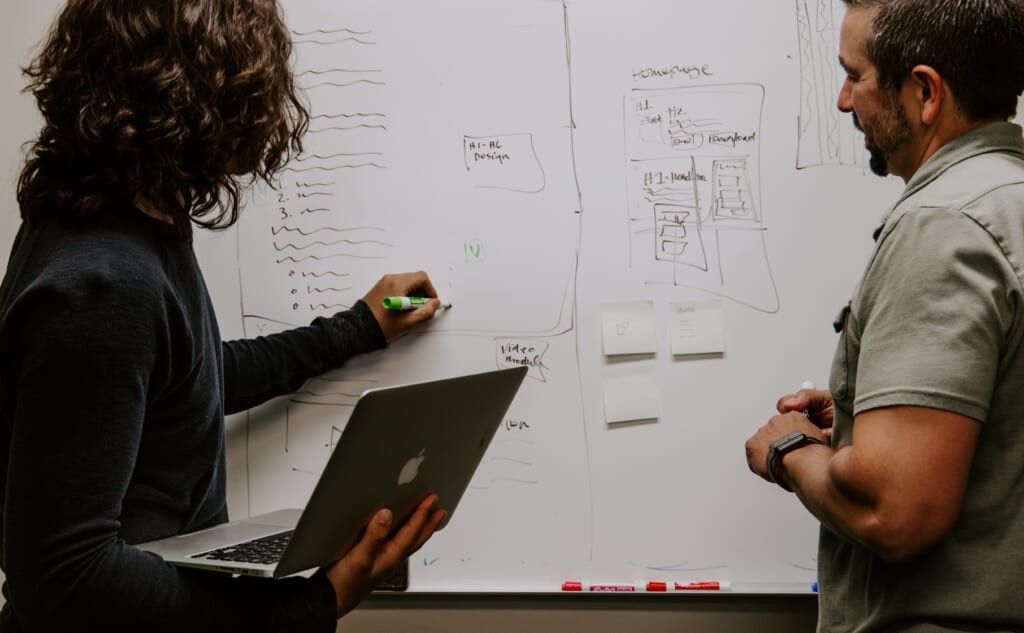white board conversation between two adults