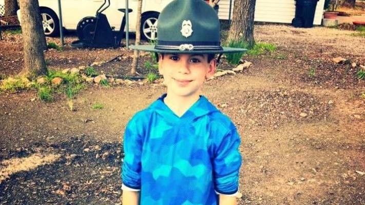 boy wearing a big hat