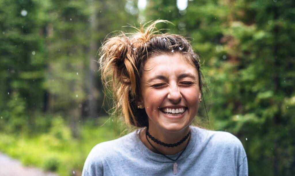 young woman smiles good energy