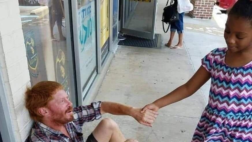 little girl holding a man
