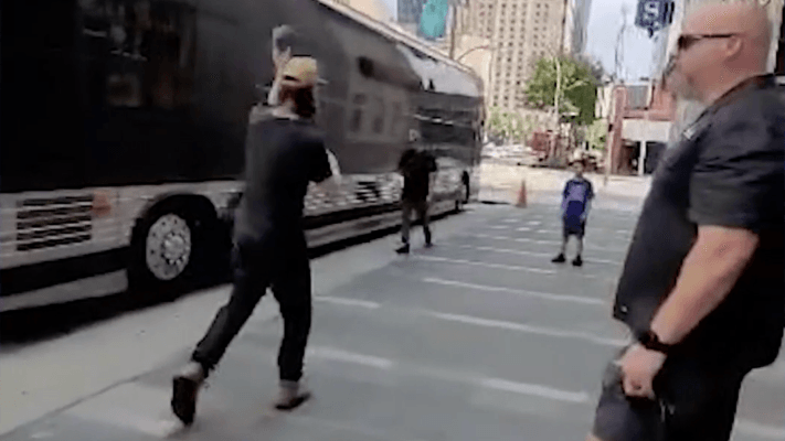 man playing catch with a young boy