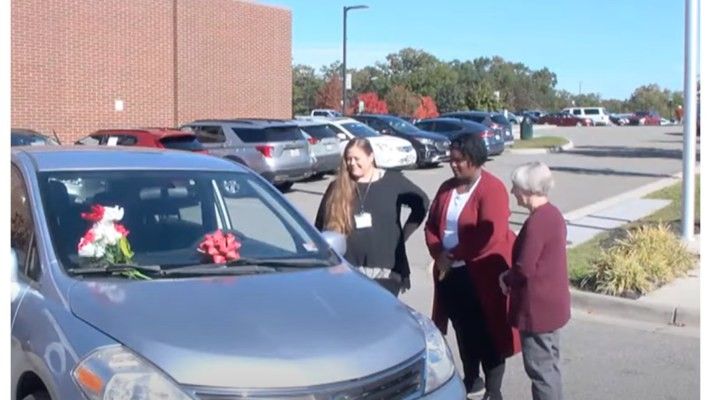 Michelle Mendez is gifted a car by Louisa County High School students.