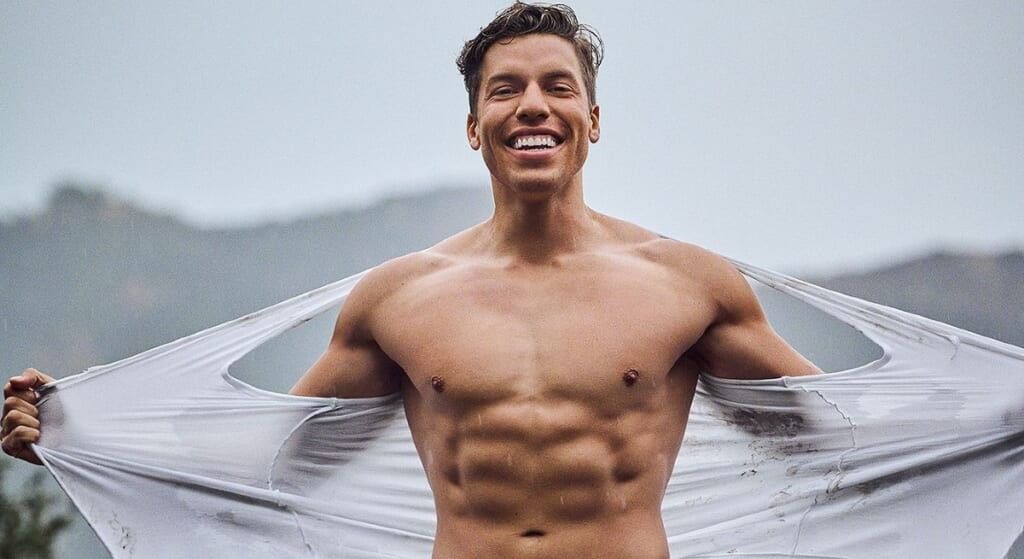 Joseph Baena, son of Arnold, flexing with his shirt off. 