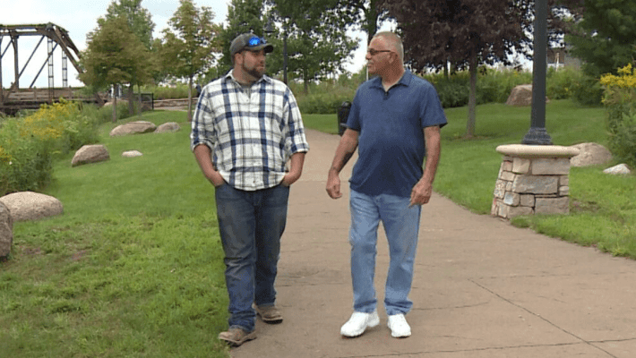 two men walking together