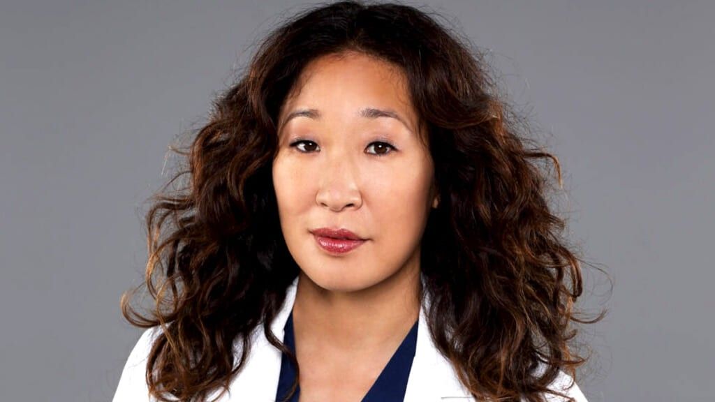 Cristina Yang smiling in a Grey