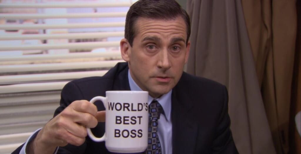 Steve Carrell in The Office holding a World