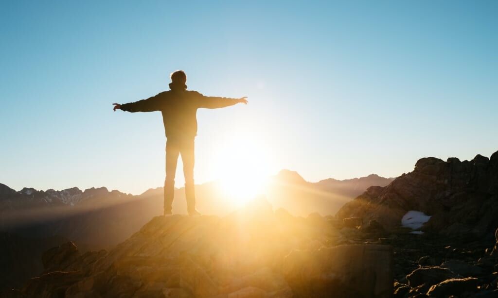 young man finds hope on a beautiful day outside