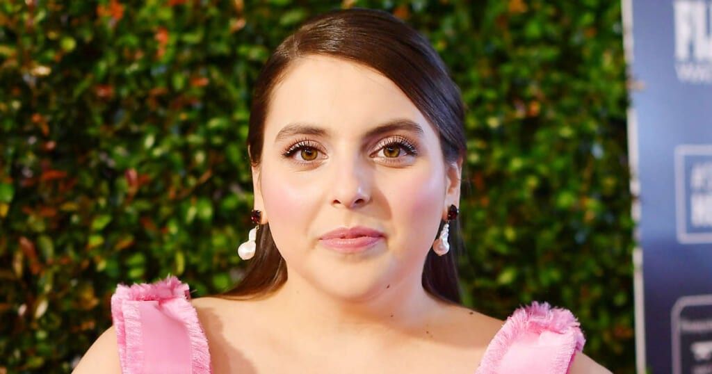 Actress Beanie Feldstein smiles at a premiere