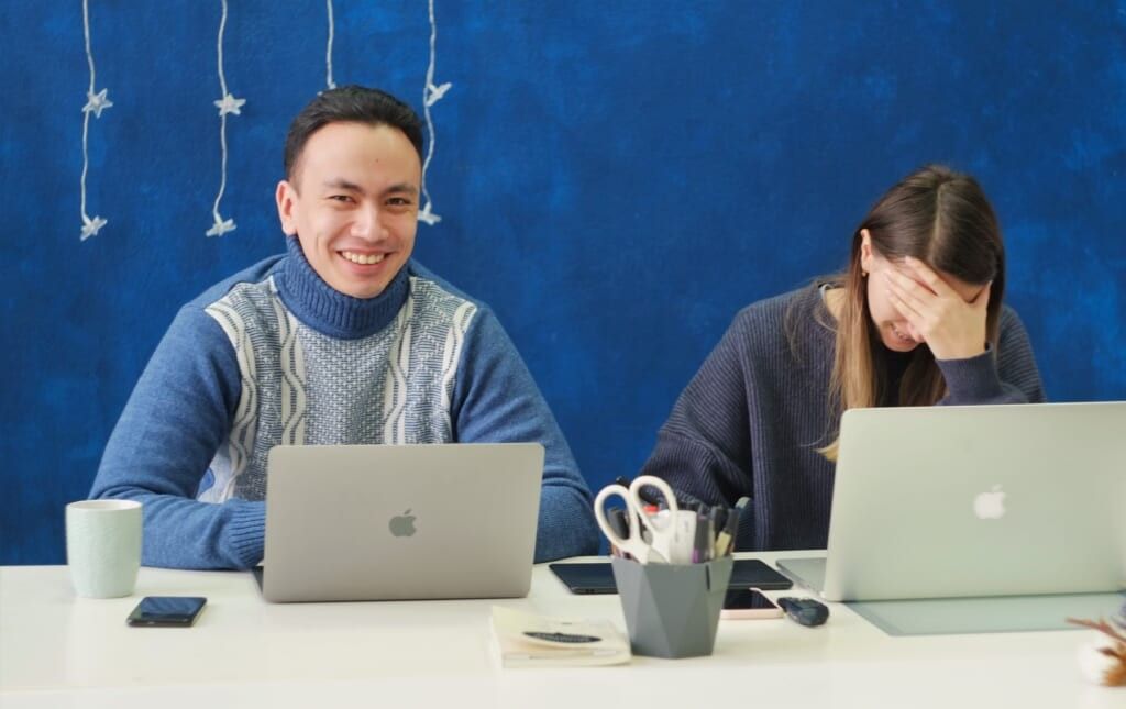 making friends in college two young people with their laptops