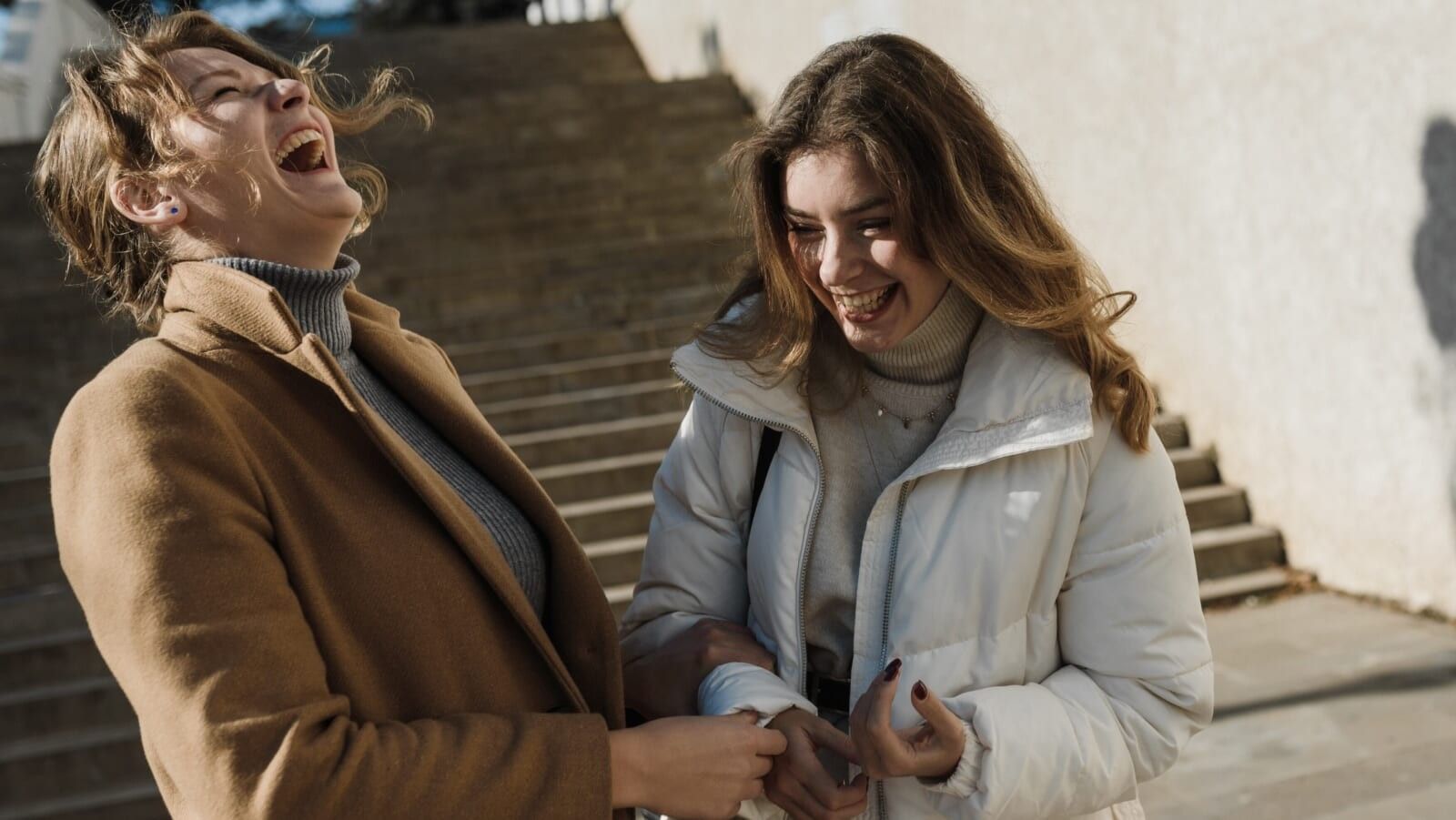 two women laughing 